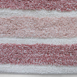 Plush microfiber bath mat with tassels
