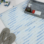 Frosty blue speckled bath mat