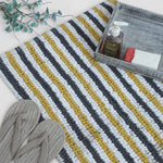 Mustard grey white striped bath mat