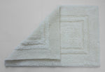 Minimal white bath mat with border