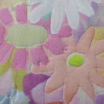 Watercolor flower print quilted pillow