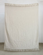 Solid ivory woven throw blanket with fringe
