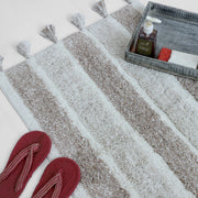 Sand and ivory striped tassel bath mat