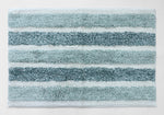 Aqua and white striped bathroom mat