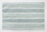 Soft striped bath mat underfoot