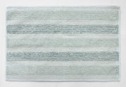 Soft striped bath mat underfoot