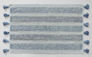 Tasselled bath mat with coastal tones