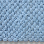 Cushioned sky blue bath rug