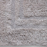 Plush woven grey bath rug