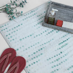 Aqua dotted plush bath mat