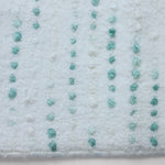Soft plush dotted bath rug