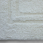 Plush white cotton bathroom mat