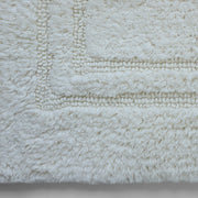Plush white cotton bathroom mat