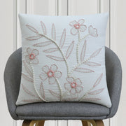 Pink and white floral embroidered cushion