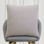 Brown and white checkered textured cushion