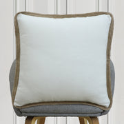 Solid white cushion with natural rope border