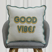 Good Vibes embroidered cushion on off-white fabric