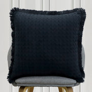 Solid black textured cushion with fringe edges