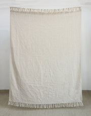 Solid ivory woven throw blanket with fringe