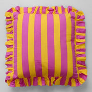 Decorative striped cushion with ruffle edges
