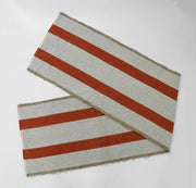 Earth-tone woven table runner with fringe detail