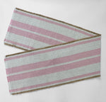 Woven striped table runner with fringed edges