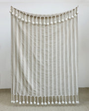 Striped pom-pom throw blanket